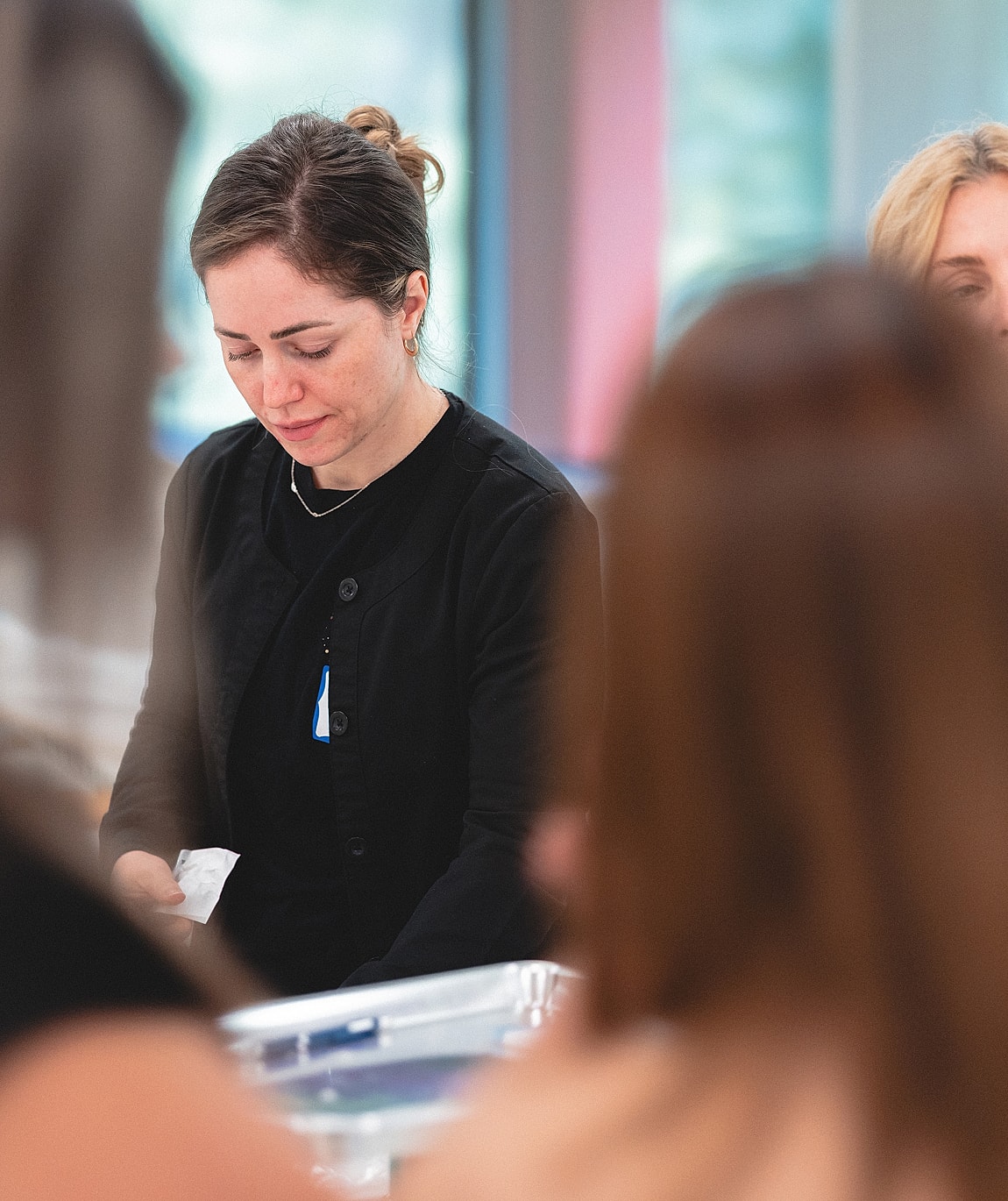 Woman focused on a task in a workshop.