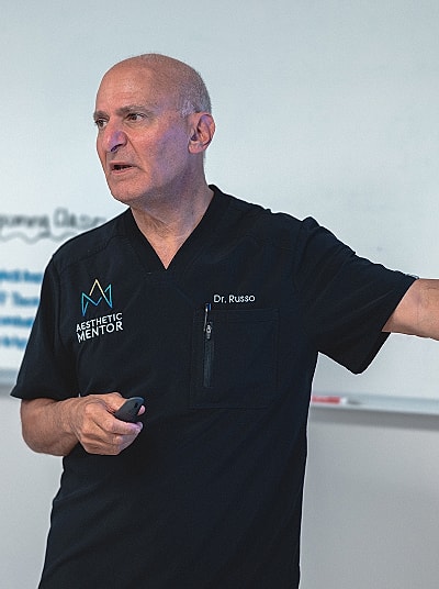 Doctor presenting in a classroom setting.