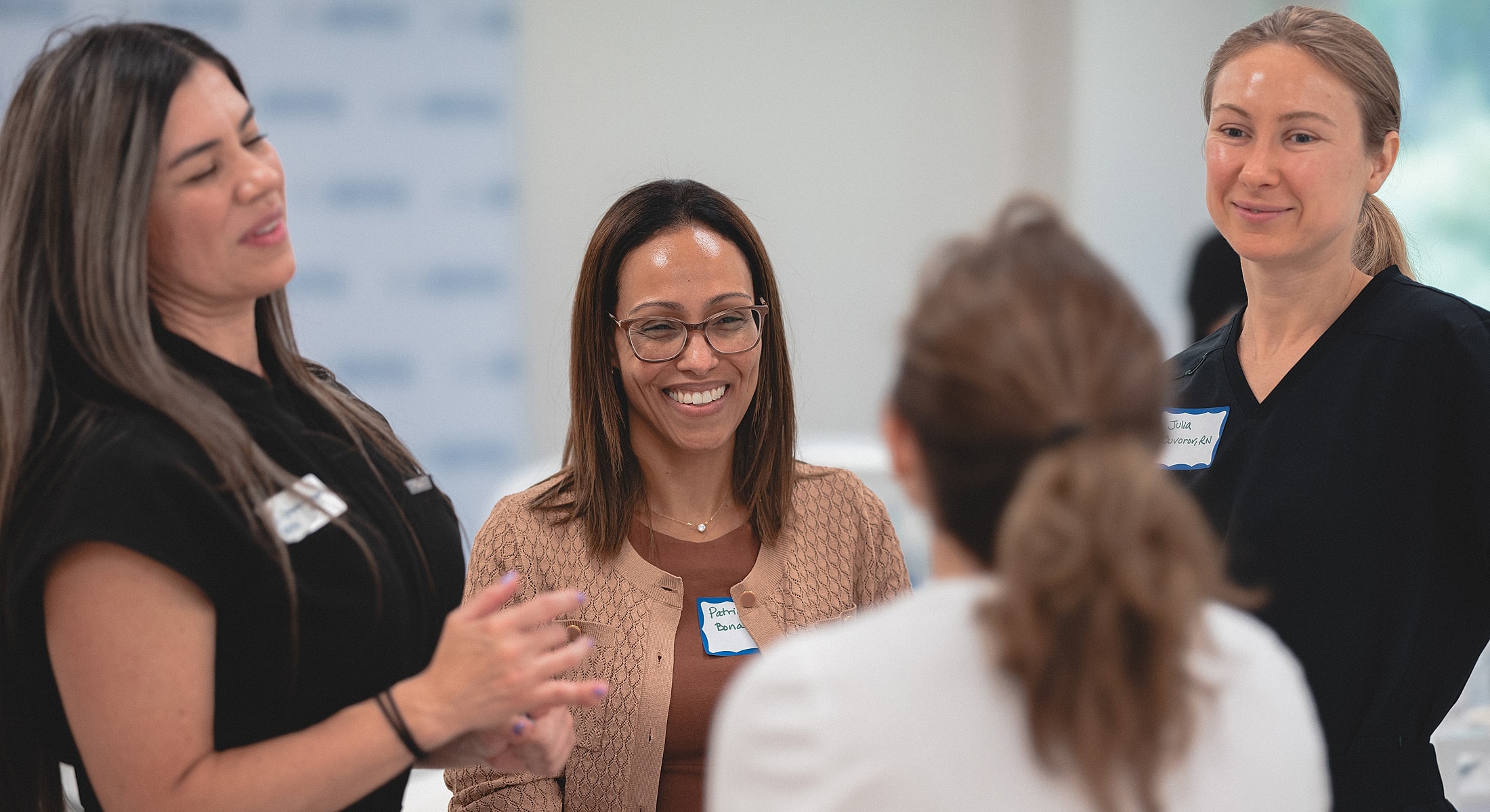 Group discussion in a bright, modern room.