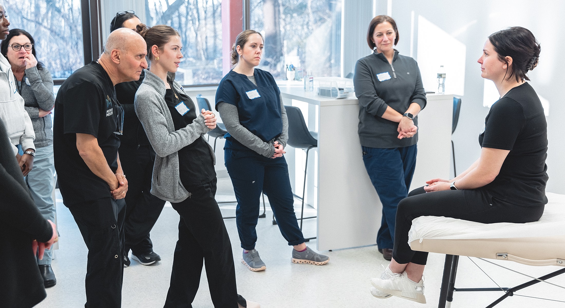 Medical professionals observing a demonstration session.