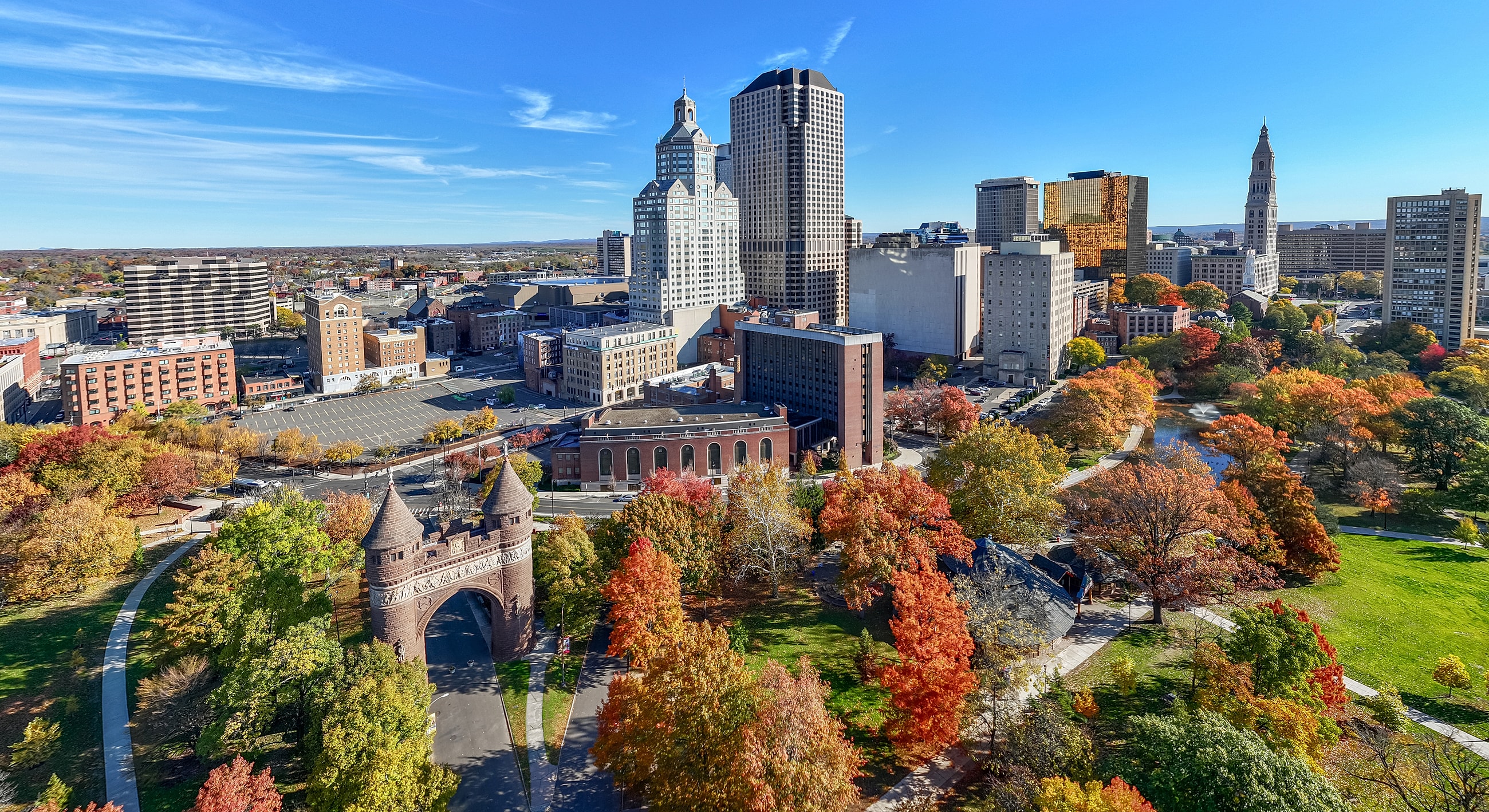Modern office building entrance with landscaping.